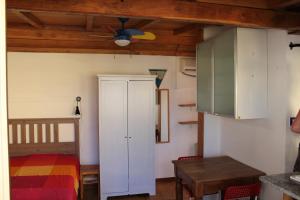 a bedroom with a bed and a ceiling fan at Romantic Studio Apartment Near Park in Rome