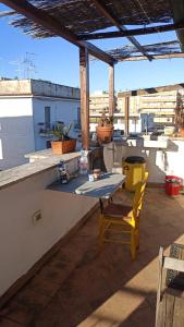 a table and chairs sitting on a roof at Romantic Studio Apartment Near Park in Rome