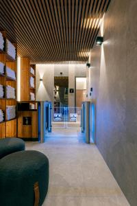 an office lobby with a vaulted ceiling at Hotel Jezerka in Seč +74 photos