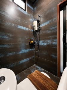 a bathroom with a wooden wall with a shower at Jip Studio - 3mn ZenBeach - Garden View in Haad Chao Phao +62 photos