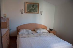 En eller flere senge i et værelse på Apartment Sara + 61 billeder