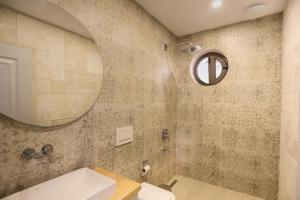 a bathroom with a sink and a mirror at Villa Sydney in Kaş