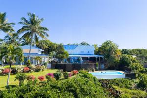an aerial view of a house with a swimming pool at THE BAY in Trou d'Eau Douce
