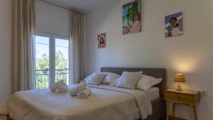 a bedroom with two beds with towels on them at Villa Emanuela by Villas Guide in Grubine +24 photos