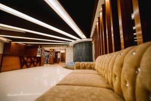 a row of chairs lined up in a room at Royal Hotel Khulna - City Center in Khulna +23 photos