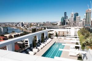 a view of the city from the rooftop of a building at The Alva Hotel Brisbane, Vignette Collection by IHG in Brisbane