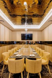 a large conference room with a long table and chairs at The Alva Hotel Brisbane, Vignette Collection by IHG in Brisbane +97 photos