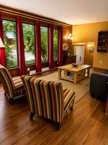 a living room with a couch and a table at The Country Barn in Port Alberni