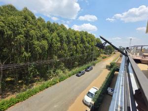 a view of a street with cars parked on the road at Crane Suites in Eldoret