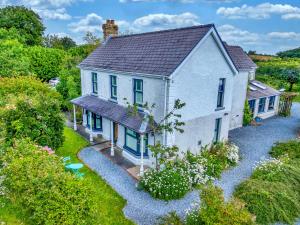 an aerial view of a white house with blue windows at Finest Retreats - Jabajak Vineyard in Whitland