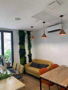 a living room with a couch and a table at Espace entier Centre de Paris in Paris +1 photo