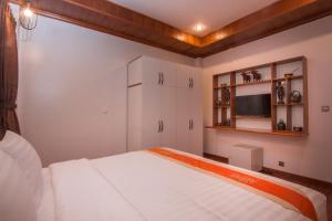 Postel nebo postele na pokoji v ubytování BB Angkor Residence