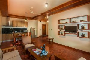 a living room with a couch and a table at BB Angkor Residence in Siem Reap