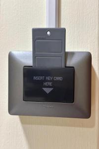 an insert key card holder on a door at Baan at Khaosan Hotel in Bangkok