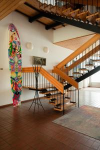 a skateboard in a room next to a staircase at Viinistu Art Hotel in Viinistu
