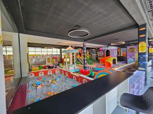a childrens play area with a playground and play equipment at HOTEL BENITA in Peje