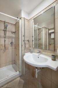 a bathroom with a sink and a shower at Hotel Moscatello in Rome