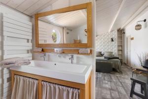 a bathroom with a sink and a mirror at Les Chambres De Miloly in La Jarrie +26 photos