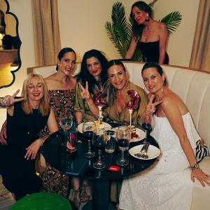 a group of women sitting around a table with wine glasses at Hotel La Chiquita in Córdoba +90 photos