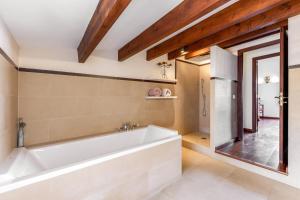 a bathroom with a large tub and a window at Can Vallori in Sencelles +20 photos