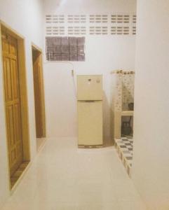 a room with a refrigerator and some boxes at Kost Eka Gorontalo in Telaga +6 photos