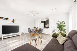 a living room with a couch and a table at CHALET 273 con PISCINA PRIVADA in Callao Salvaje