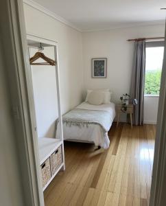 a bedroom with a mirror and a bed in it at Barossa Suites on Basedow in Tanunda +7 photos