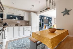 a kitchen with a table with a bowl on it at Driftwood - Crail in Crail