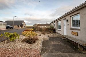 a house on the side of a street at Driftwood - Crail in Crail +19 photos