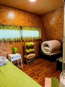 a room with a bed and a bunk bed and a table at Valley Cabril Selvagem in Cabril