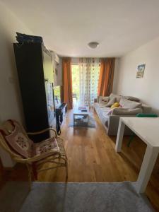 a living room with a couch and a table at Eva in Pržno