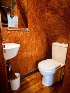 a small bathroom with a toilet and a sink at Valley Cabril Selvagem in Cabril