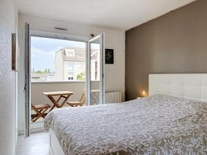 Postel nebo postele na pokoji v ubytování EM LIFE Strasbourg