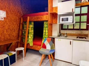 a small kitchen with a bunk bed in a room at Valley Cabril Selvagem in Cabril