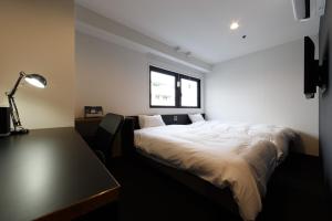 Postel nebo postele na pokoji v ubytování Hotel Citio Shizuoka
