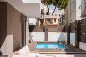 a swimming pool on the side of a building at Alimos Escape 3 in Athens