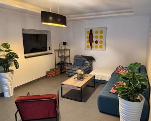 a living room with a blue couch and a table at Villa Nina in Šmrika