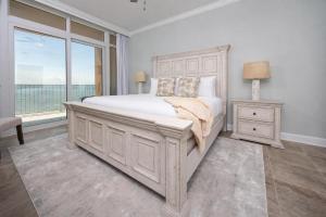 a bedroom with a large bed and a window at Phoenix Gulf Towers 1008 condo in Gulf Shores +73 photos