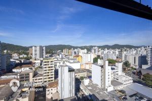 an aerial view of a city with tall buildings at Cobertura Duplex Vista Cidade Centro TV4061 in Blumenau