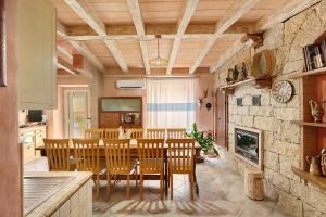 a kitchen and dining room with a table and chairs at Camera a Dorgali al B&B Sa Madalena in Dorgali +25 photos