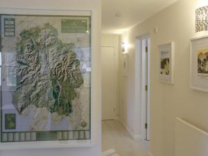 a map hanging on a wall in a hallway at 12A Elm Court in Keswick