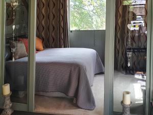 a bedroom with a bed and a window at Willow's Rest in Crafthole