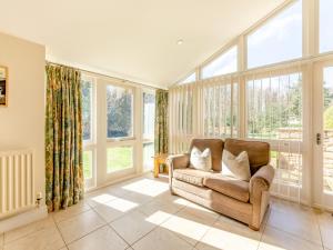 a living room with a couch and large windows at Wellwood - Uk49290 in Preston