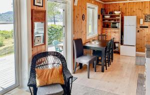 a kitchen and dining room with a table and chairs at Stunning Home In Seim With Wifi in Seim +6 photos