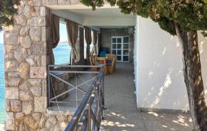 a door leading into a house with the water at Nice Home In Karlobag With Wifi in Karlobag