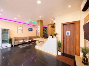 a lobby of a hospital with a waiting room at Hotel Pushparaj Puri - Beach front Hotel near Light House - Sea Facing AC Rooms - with Restaurant, Parking Facilities in Puri