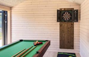a room with a pool table and a dartboard at 3 Bedroom Beautiful Home In Fjerritslev in Fjerritslev
