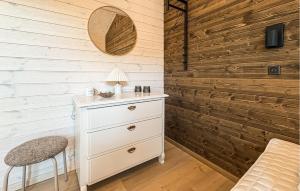 a bedroom with a white dresser and a mirror at 3 Bedroom Beautiful Home In Fjerritslev in Fjerritslev +18 photos