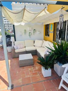 a living room with a couch and a tent at Penthouse - Beach - Sea View - Pool - 40 sqm Private Terrace - One Bedroom - Sleeping Alcove in Benalmádena
