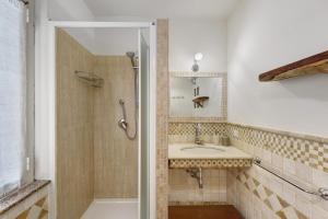 a bathroom with a sink and a shower at Camera a Dorgali al B&B Sa Madalena in Dorgali